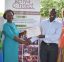 Wolf Trap Master Teaching Artist Christina Farrell, Institute Early Education Specialist Luisa Aviles and Kenya Connect's Executive Director Musyoka present Kenyan early childhood educators with a certificate of completion.