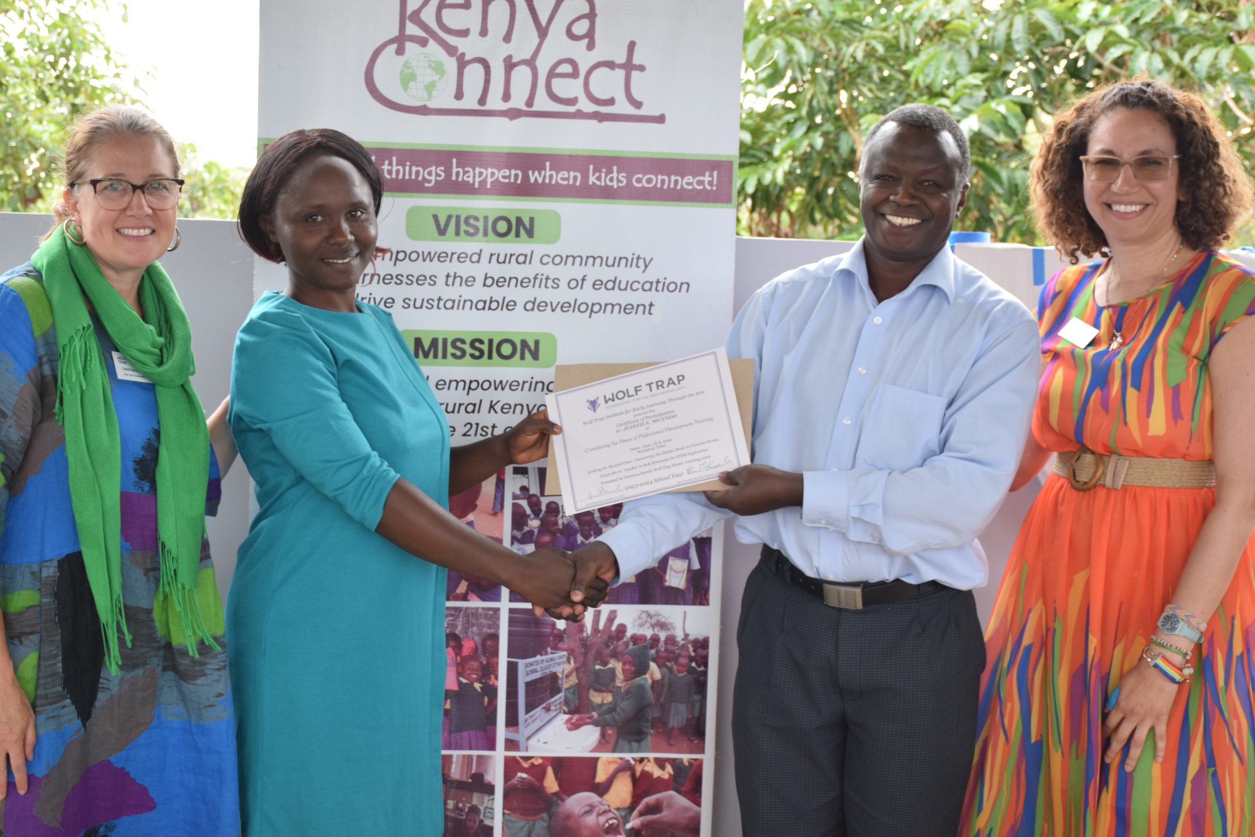 Wolf Trap Master Teaching Artist Christina Farrell, Institute Early Education Specialist Luisa Aviles and Kenya Connect's Executive Director Musyoka present Kenyan early childhood educators with a certificate of completion.